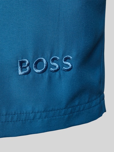 Produktfoto, Badeshorts mit Label-Applikation Modell 'DOGFISH' von BOSS in Unifarbe Blau, glatte Textur, sichtbares BOSS-Logo, Regular Fit