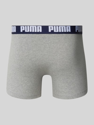 Produktfoto, grauer Trunk aus Baumwoll-Mix mit dunkelblauem Bund und weißem PUMA-Schriftzug, Modell 'Everyday' von PUMA, glatte Textur