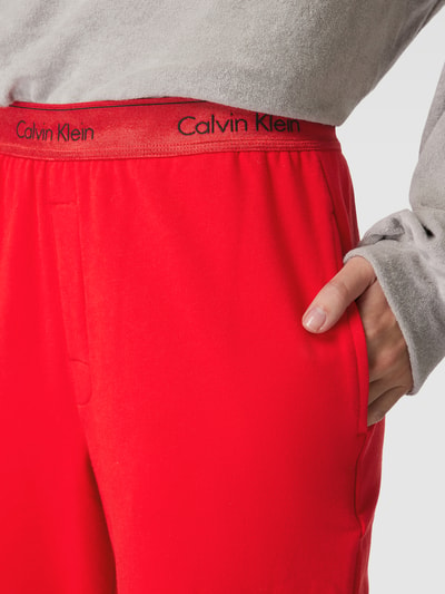 Kup online Calvin Klein Underwear Spodnie dresowe z elastycznym paskiem z  logo model 'HOLIDAY' (czerwony)