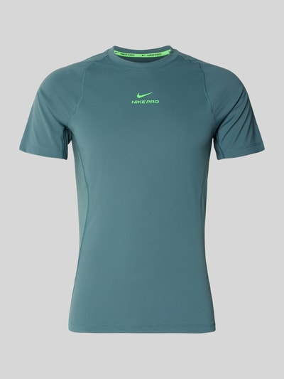 Produktfoto, T-Shirt mit Logo-Print und Raglanärmeln von NIKE TRAINING in Blaugrün, Straight Fit, Rundhalsausschnitt, Rückenlänge 71 cm bei Größe M.