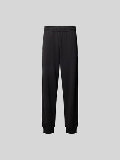 Produktfoto, schwarze Sweatpants mit Label-Detail von Diesel aus reiner Baumwolle, lockerer Schnitt, elastischer Bund, Gesäßtasche