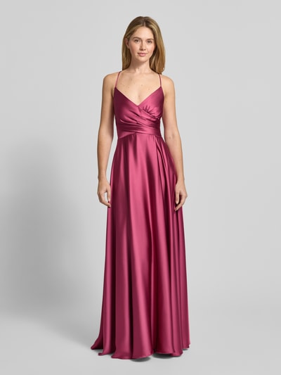 Kobiece modelka nosi Sukienka wieczorowa w kopertowym stylu od Jake*s Cocktail z satyny, taliowany krój, dekolt w serek, cienkie ramiączka, wiązanie z tyłu, długość do ziemi, wszyty zamek błyskawiczny, długość tyłu w rozmiarze 36: 130 cm, szerokość w rozmiarze 36: 34 cm, widok całej sylwetki z przodu.