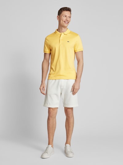 Lacoste Koszulka polo o kroju regular fit w jednolitym kolorze Jasnożółty 1