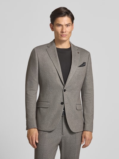 Männermodel trägt Slim Fit Sakko mit Baumwoll-Anteil Modell 'Nick' von Zuitable in Grau, Reverskragen, 2-Knopfleiste, Ganzkörperansicht von vorne.