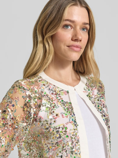 Frauenmodel trägt Semitransparente Jacke mit Pailletten von Milano Italy in Mesh mit Pailletten-Details, Nahaufnahme Oberkörper.