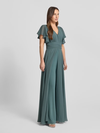 Frauenmodel trägt Jumpsuit mit V-Ausschnitt von Swing in Petrol, taillierter Schnitt, Stoff mit Stretch, fließende Textur, Ganzkörperansicht von vorne.