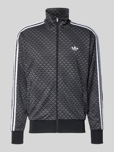 Produktfoto, Sweatjacke mit Stehkragen von adidas Originals in Schwarz mit Allover-Muster, Lockerer-Schnitt, Reißverschluss, Label-Stitching, Reißverschlusstaschen, gerippte Abschlüsse, Rückenlänge 72 cm, Ärmellänge 65 cm.