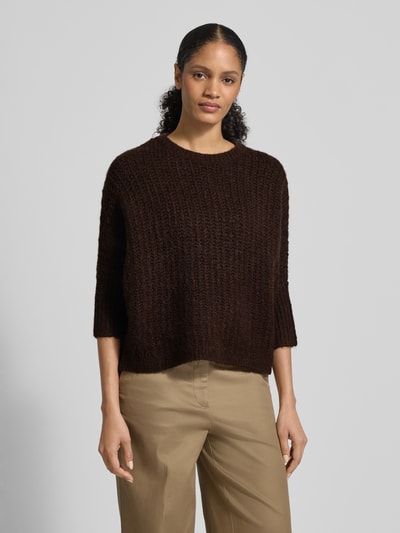 Vrouwenmodel draagt Strickpullover met wol-aandeel model 'TUMELDA' van Someday, los vallende fit, geribde boorden, ronde hals, 3/4-mouwen, materiaal-mix, voorkant volledig zicht.