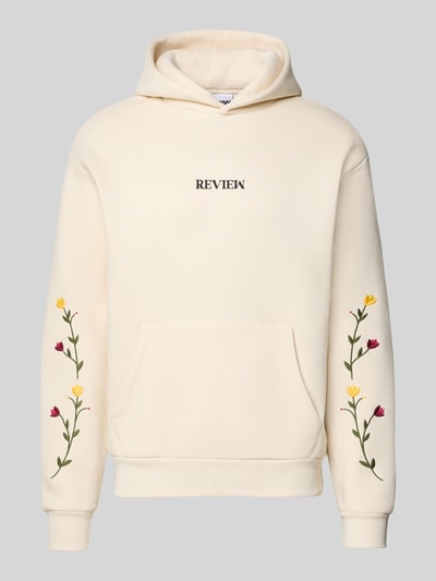 Produktfoto, Regular Fit Hoodie mit Logo-Stitching von REVIEW aus cremefarbenem Baumwoll-Mix mit floralem Stitching und Känguru-Tasche