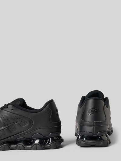 Produktfoto, Sneaker mit Logo-Detail Modell 'REAX 8' von Nike in Schwarz, strukturierte Sohle, glattes Obermaterial, Damen Sneaker von Nike