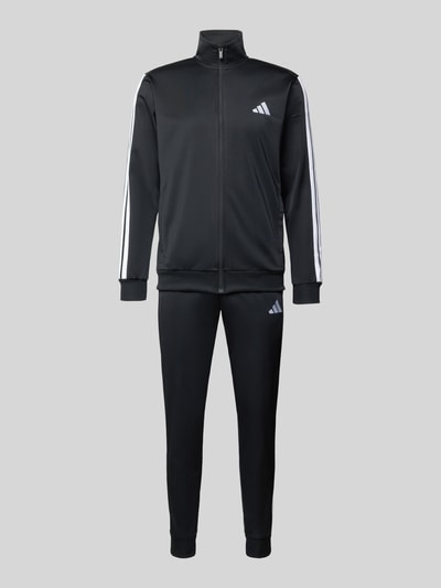 Produktfoto, Trainingsanzug mit Stretch-Anteil von adidas Sportswear, czarny, elastyczna mieszanka materiałów, krój prosty, stójka, zamek błyskawiczny, elastyczne wykończenia, elastyczny pas, wpuszczane kieszenie, detale z logo, szerokość w rozmiarze M: 39 cm, długość tyłu w rozmiarze M: 70 cm, szerokość ramion w rozmiarze M: 44 cm, długość rękawów w rozmiarze M: 65 cm, długość wewnętrzna nogawki w rozmiarze M: 73 cm.