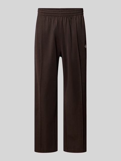 Produktfoto, Straight Fit Sweatpants mit Logo-Stitching Modell 'Firebird' von adidas Originals aus Baumwoll-Mix in Dunkelbraun, Ziernaht, elastischer Bund, Innenbeinlänge 69 cm bei Größe M.