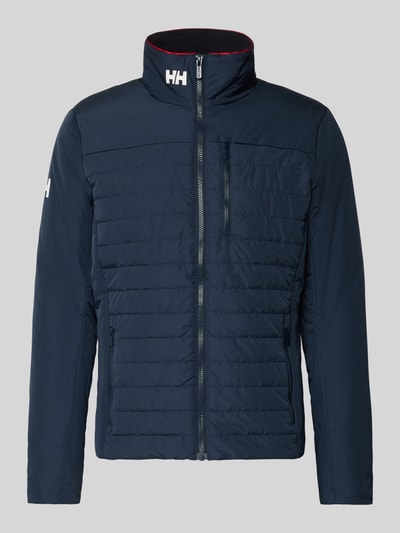Produktfoto, Regular Fit Jacke mit Stehkragen von Helly Hansen in Dunkelblau mit Logo-Print, Napoleontasche, Reißverschlusstaschen, glatte Struktur