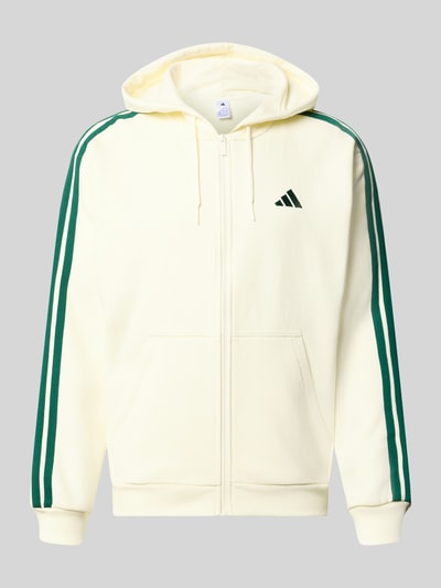 Produktfoto, cremefarbene Regular Fit Sweatjacke aus Baumwoll-Mix von adidas Sportswear, grüne Streifen, glatte Struktur