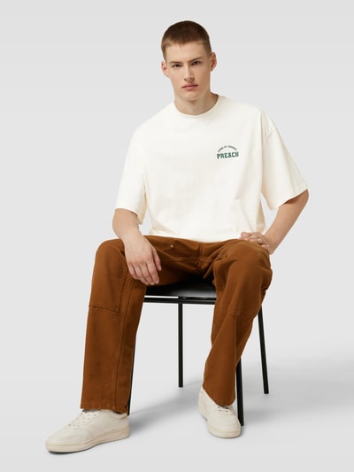 Preach Oversized T-Shirt mit Label-Print Modell 'Varsity Icons' Offwhite 1