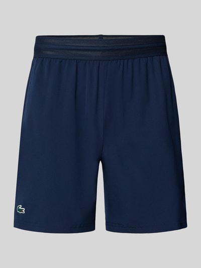 Produktfoto, Loose Fit Sport-Shorts mit Mesh-Bund von Lacoste, Optik: Unifarben, Logo-Stitching, elastischer Mesh-Bund, seitliche Eingrifftaschen