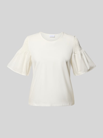 Produktfoto, Regular Fit T-Shirt mit Smok-Detail von Comma aus reiner Baumwolle, ausgestellte Ärmel, Rundhalsausschnitt, kurzärmelig, 54 cm Rückenlänge bei Größe 36, cremeweiße Farbe, glatte Textur.