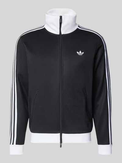 Produktfoto, Regular Fit Trainingsjacke mit Stehkragen Modell 'Classic' von adidas Originals aus schwarzem Baumwoll-Mix mit Zweiwege-Reißverschluss, Logo-Stitching und elastischen Abschlüssen, Rückenlänge bei Größe M 68 cm, Ärmellänge 65 cm.