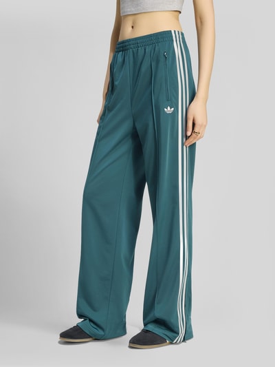 adidas Originals Spodnie dresowe o kroju loose fit z paskami w kontrastowym kolorze Ciemnozielony 4