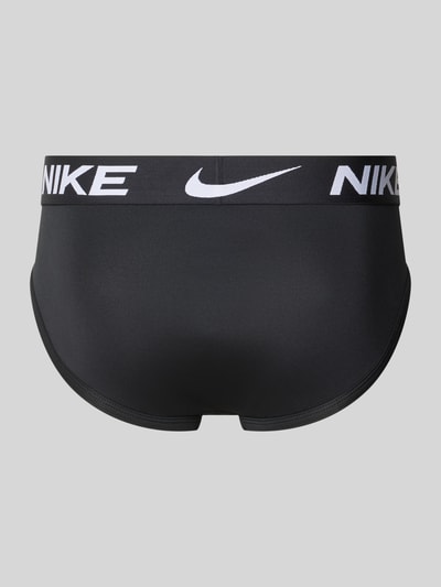 Produktfoto, schwarzer Slip mit Label-Bund im 5er-Pack von Nike, glatte Oberfläche, weiße Beschriftung auf grauem Hintergrund. Herren Slip von Nike