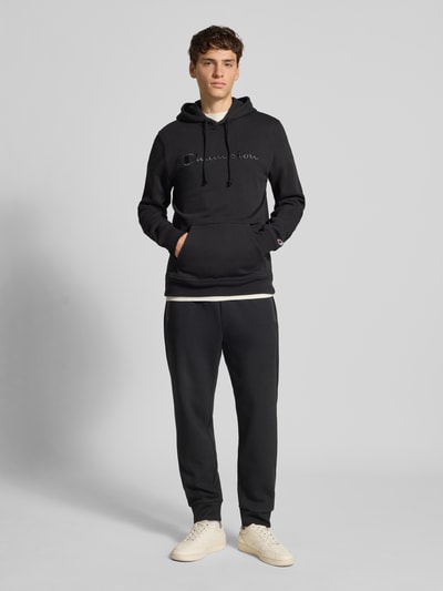 CHAMPION Spodnie dresowe z elastycznym pasem i tunelem Czarny 1