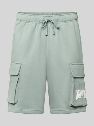 Produktfoto, Sweatshorts mit Cargotaschen und Logo von CHAMPION in Hellgrün, Baumwoll-Mix, Relaxed Fit, elastischer Bund, sichtbare Struktur