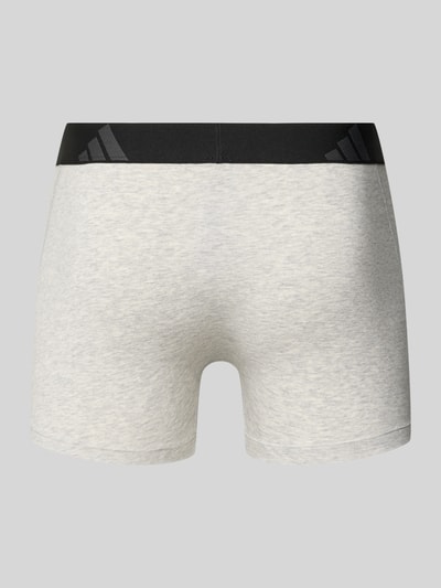 Männermodel trägt Trunks aus Baumwoll-Mix im 5er-Pack von adidas Sportswear, Optik: Unifarben, Logo-Print, Bundabschluss: elastisch, Materialverarbeitung: Jersey-Stretch, Ganzkörperansicht Rückansicht.