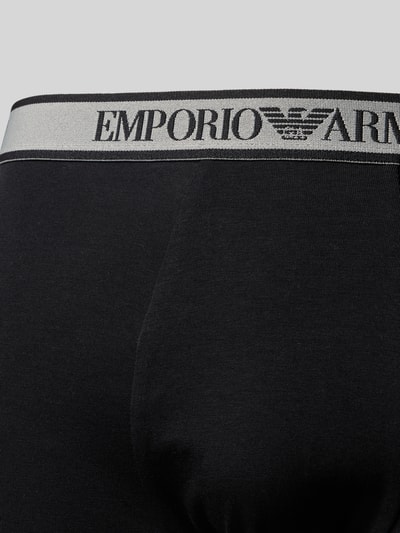 Produktfoto, Slim Fit Trunks mit Logo-Stitching im 3er-Pack von Emporio Armani aus elastischem Baumwoll-Mix in Schwarz mit grauem Bund und Markenlogo.