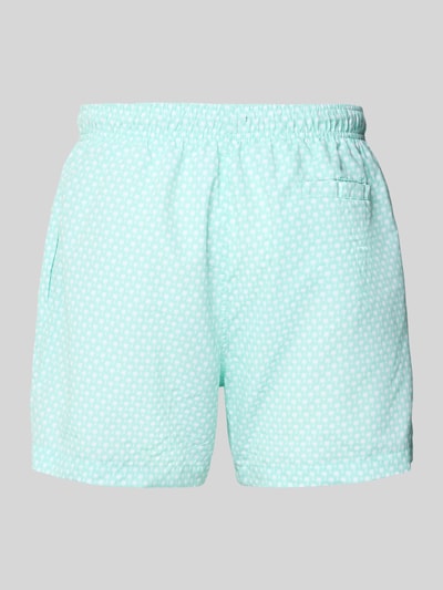 Produktfoto, Badehose mit Gesäßleistentasche von MCNEAL in Mint mit weißem Punktmuster, Loose-Fit, elastischer Bund mit Kordelzug, Logo-Stitching