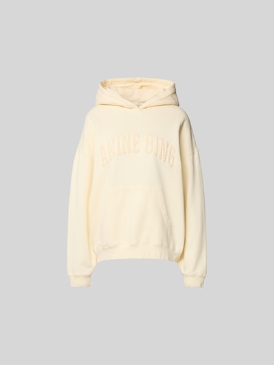 Produktfoto, Oversized Hoodie aus reiner Baumwolle von Anine Bing in Creme mit Känguru-Tasche, Label-Detail, elastische Abschlüsse.