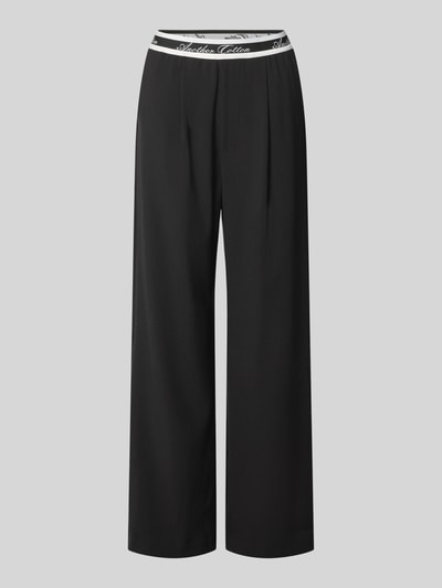 Produktfoto, spodnie z szerokimi nogawkami Wide Leg Hose mit elastischem Logo-Bund von ANOTHER COTTON LAB, mieszanka materiałów z dodatkiem streczu, wpuszczane kieszenie, szerokość w rozmiarze S: 36 cm, długość wewnętrzna nogawki w rozmiarze S: 75 cm, czarne, gładka faktura