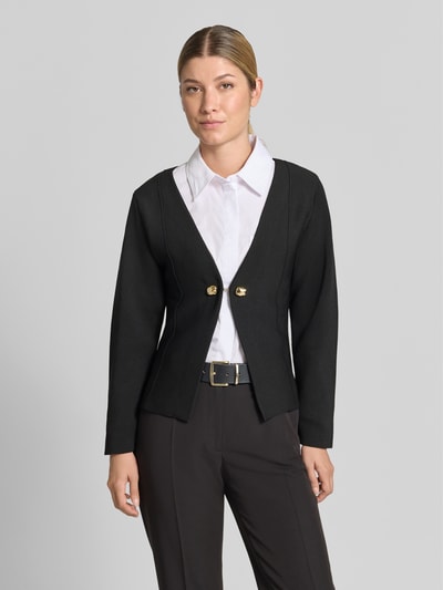 Frauenmodel trägt Cardigan mit Zierknöpfen Modell 'APOLLO' von MANGO in Schwarz, V-Ausschnitt, gerader Schnitt, Nahaufnahme Oberkörper.