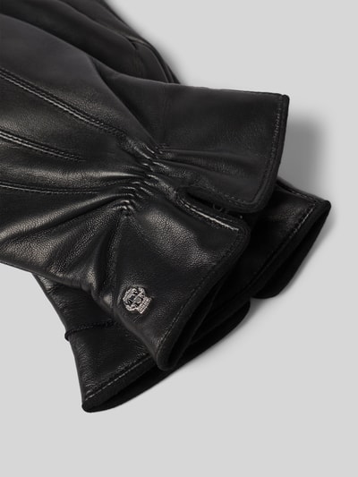 Produktfoto, schwarze Handschuhe aus echtem Leder Modell 'Antwerpen' von Roeckl, Touch-Funktion, Raffungen, Logo-Detail, glatte Struktur