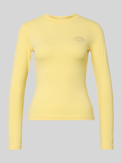 Produktfoto, Slim Fit Longsleeve mit Logo-Detail von ANOTHER COTTON LAB aus elastischem Baumwoll-Mix in zartem Gelb, Rundhalsausschnitt.