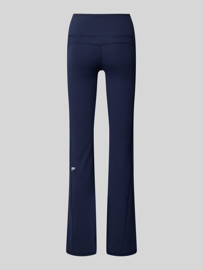 Produktfoto, dunkelblaue Flared Fit Leggins mit breitem Bund und Eingrifftaschen, Modell 'OASIS' von Fabletics, glatte Textur