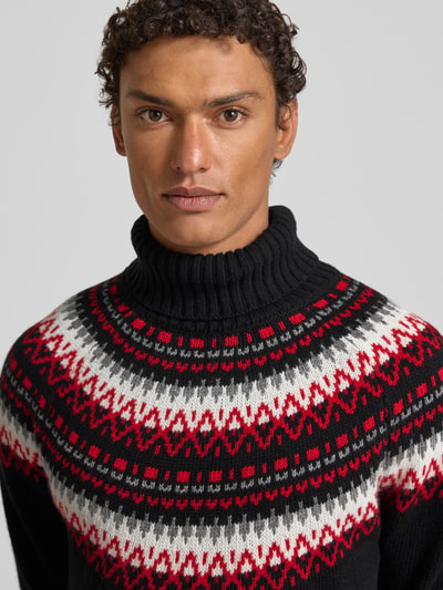 Männermodel trägt Strickpullover mit Rollkragen von Gant, Baumwoll-Woll-Mix mit Viskose-Anteil, lockerer Schnitt, Nahaufnahme Oberkörper.