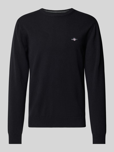 Produktfoto, schwarzer Regular Fit Pullover aus reiner Wolle von GANT, glatte Textur, dezentes Logo auf der Brust, Herren Pullover