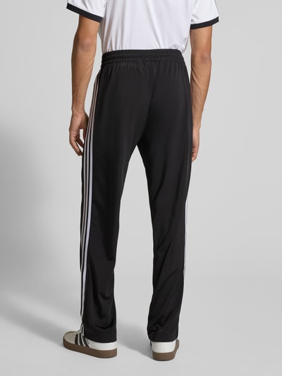 adidas Originals Spodnie treningowe z kieszeniami zapinanymi na zamek błyskawiczny model ‘FIREBIRD’ Czarny 5