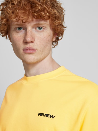 REVIEW Oversized T-Shirt mit Label-Print Pastellgelb 3