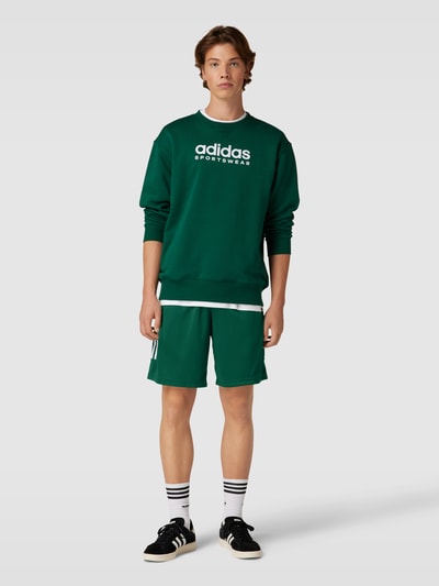 ADIDAS SPORTSWEAR Szorty z dzianiny dresowej z nadrukiem z logo model ‘TIRO’ Butelkowy zielony 1