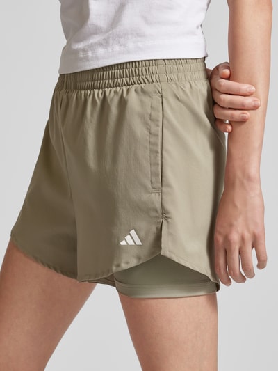 ADIDAS SPORTSWEAR Szorty o luźnym kroju z efektem dwóch warstw Oliwkowy 3