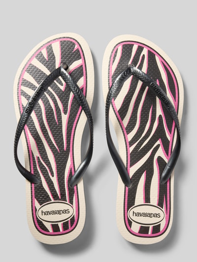 Produktfoto, Flip Flip mit Logo-Detail von Havaianas in Schwarz, Pink und Beige mit Animal-Print, abgerundete Passform, offene Ferse, Absatzhöhe 1 cm bei Größe 39/40