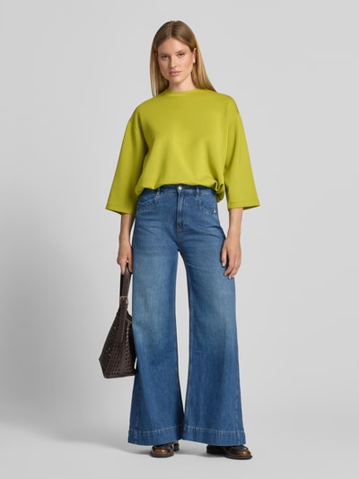 Vrouwenmodel draagt sweatshirt met tunnelkoord Model 'Tahani' van JOOP!, Materiaalmix met modal, regular fit, ronde hals, 3/4-mouw, effen geel, gladde textuur, volle lichaamsaanzicht van voren.