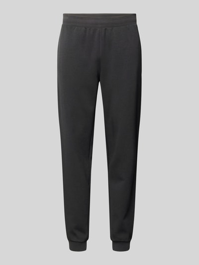 Produktfoto, Sweatpants aus Baumwoll-Mix von EA7 Emporio Armani in Schwarz, lockere Passform, elastischer Bund, Eingrifftaschen, glatte Textur.