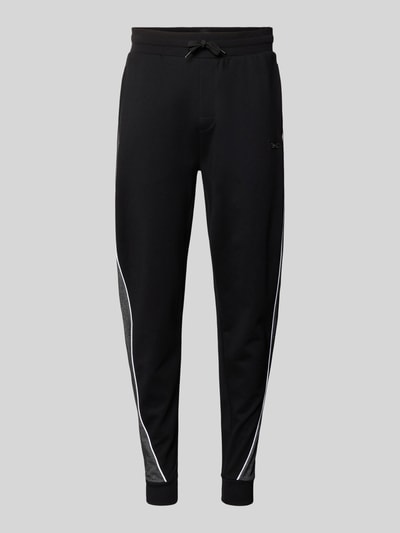 Produktfoto, Regular Fit Sweatpants aus Baumwoll-Mix von BOSS in Optik: Unifarben mit Galonstreifen, Label-Applikation aus Metall, Tunnelzug, Bundabschluss und Beinabschluss elastisch, seitliche Eingrifftaschen, Materialverarbeitung: Sweat, Material: Baumwoll-Mix