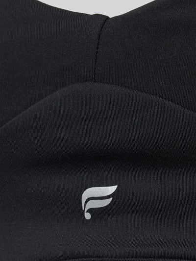 Produktfoto, czarny Stanik z nadrukiem z logo PURELUXE LONGLINE od Fabletics, elastyczna mieszanka materiałów, typ Low Impact