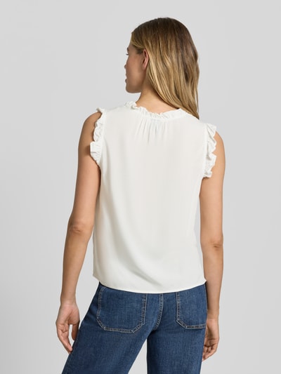 Frauenmodel trägt Regular Fit Blusentop aus reiner Viskose Modell 'ALBA' von Vero Moda, Optik: Unifarben, Rüschenkragen, Ganzkörperansicht Rückansicht.
