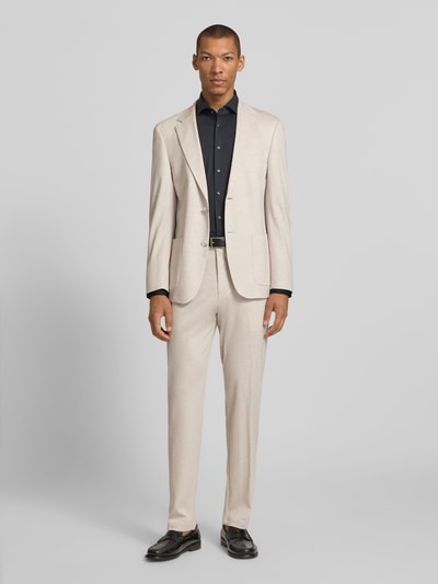 Männermodel trägt Slim Fit Anzugsakko aus Viskose-Mix Modell 'ARNDT4-J 2' von Strellson in melierter Optik, Ganzkörperansicht von vorne.