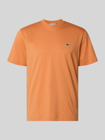 Produktfoto, Regular Fit Poloshirt aus reiner Baumwolle van Lacoste in effen oranje met logo-stitching, ronde hals, korte mouw, katoen