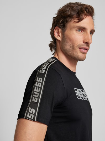 Guess Activewear T-shirt z napisem z logo model ‘ARLO’ Czarny 3